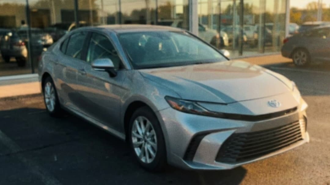 Rep's phone video of a silver 2025 Camry on the dealership lot